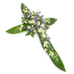 A solemn, handcrafted floral cross photographed on a clean white background from a slight overhead angle so the full shape reads clearly and simply. The cross is built from broad, glossy green tropical leaves-reminiscent of Ti leaves-laid edge to edge so their smooth, veined surfaces form the arms and central shaft; the leaves catch a soft, even light that highlights their waxy sheen and natural ridges. At the intersection and extending gently along each arm is a dense, refined cluster of blooms in a muted, comforting palette: creamy ivory lisianthus with ruffled, layered petals and small closed buds, intermingled with small, rounded white spray chrysanthemums that lend brightness and a softer silhouette. Scattered through those white tones are sprays of tiny, star-shaped lavender or light purple accents-likely limonium or petite asters-that give delicate contrast and a faint impression of depth. Fine, understated green filler foliage threads between the flowers, softening edges and adding textural nuance. The overall scent would be faintly green and fresh rather than heady, matching the arrangement's peaceful mood. This is a classic sympathy tribute designed to read as both a symbol of faith and an offering of quiet comfort, appropriate for funeral services, memorials, or a church vigil. As a local florist familiar with St Paul's Cray and the peaceful banks of the River Cray, I picture this arrangement at a small village service near St Paul's parish church-its calm colour story and traditional cross form offering dignity, gentle hope, and a respectful expression of remembrance.